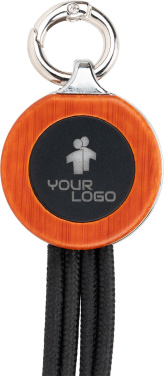 Logotrade Werbeartikel das Foto: 4-in-1-Kabel mit elighted-Logo im Holzgehäuse